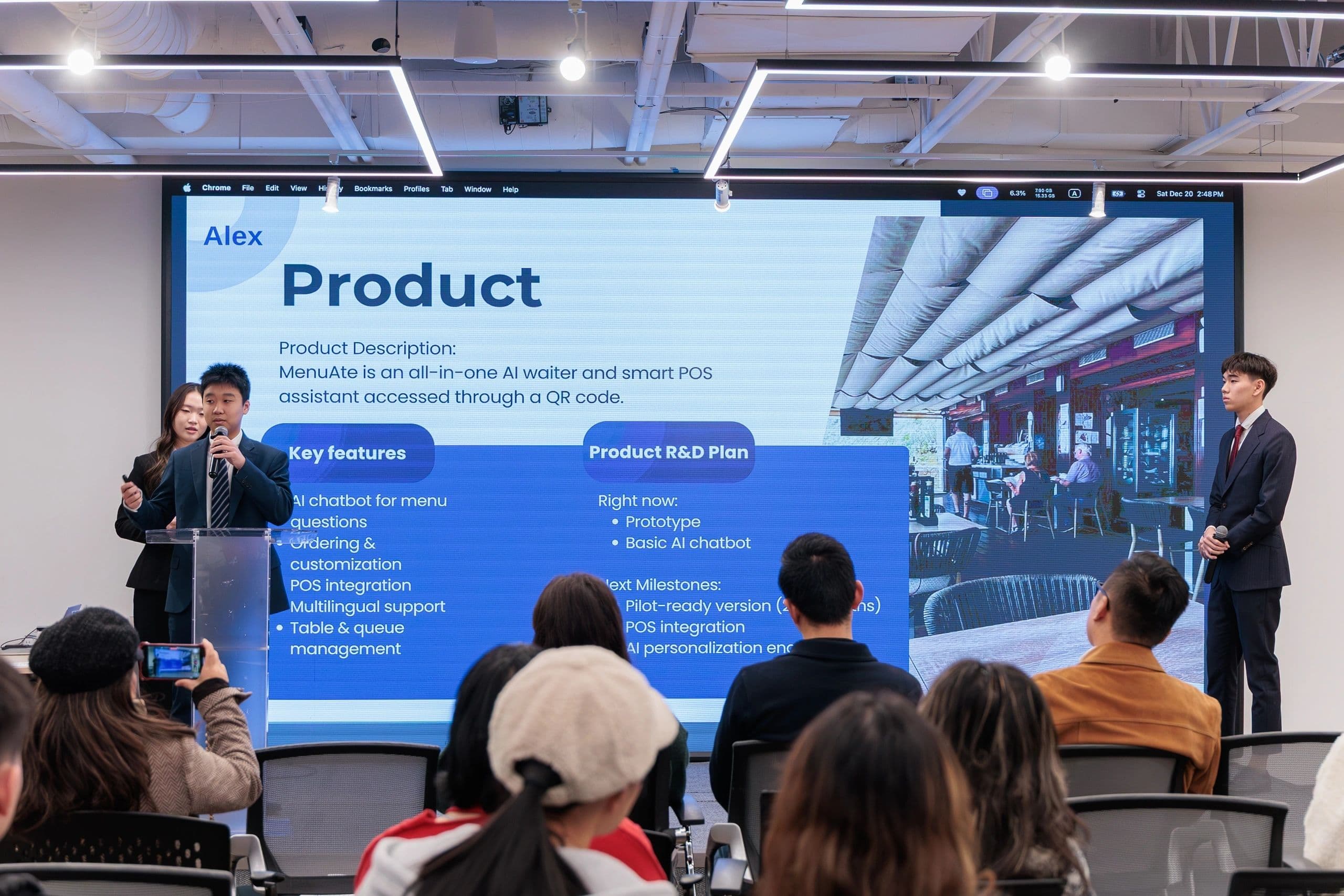 Student presenting AI project to mentors